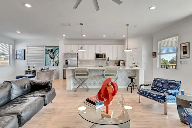 a view of a living room and a floor to ceiling window