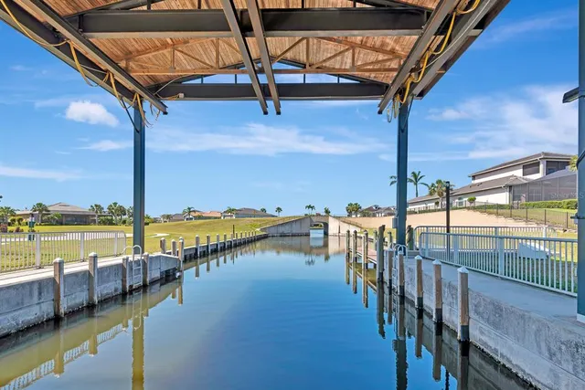 a view of a lake with boats and trees in the background