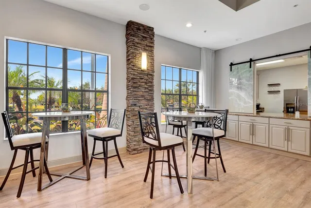 an aerial view of residential houses with outdoor space and lake view