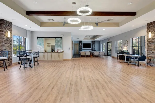 an aerial view of a house with a garden and swimming pool