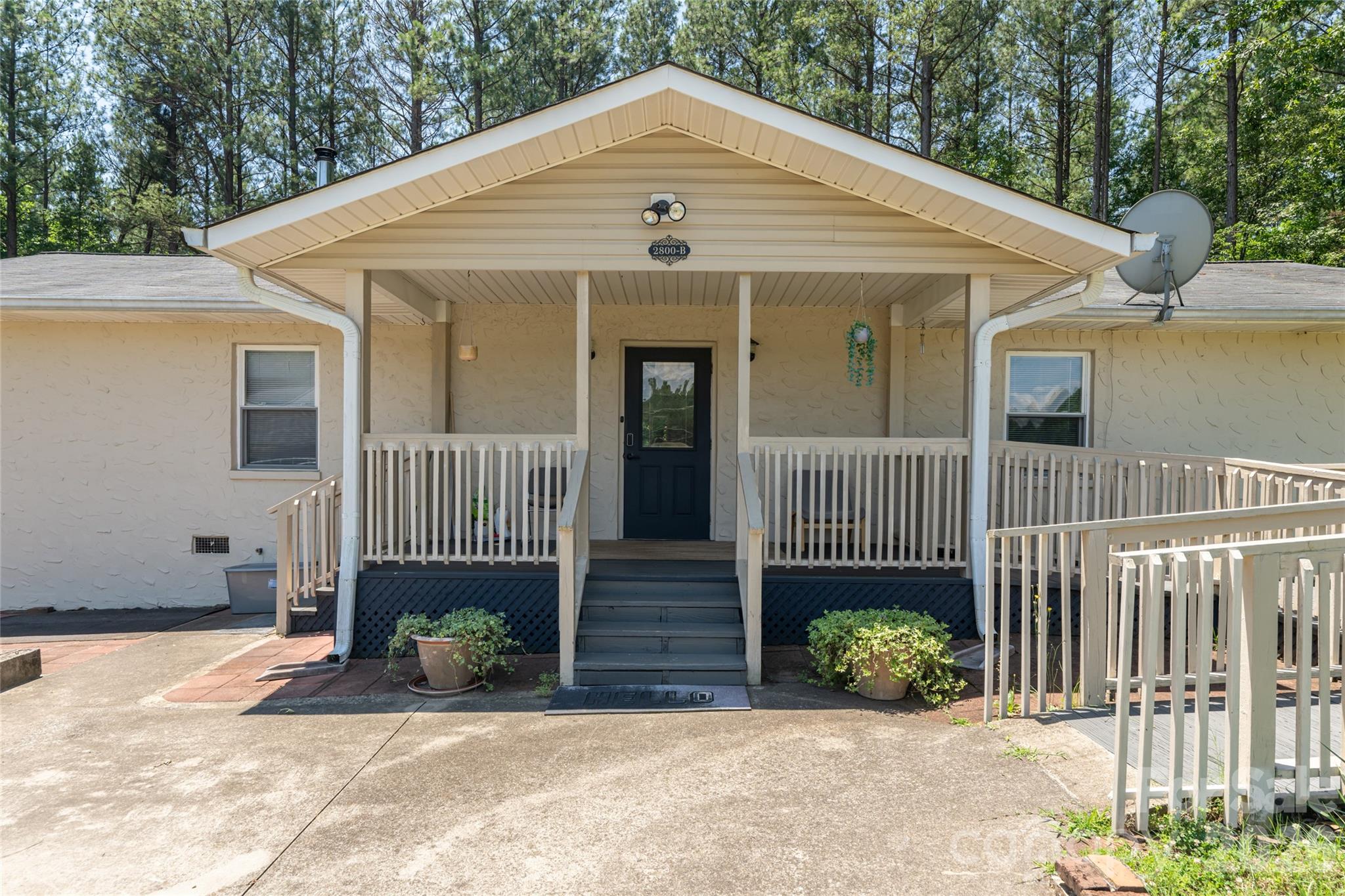2800 Coxe Road Tryon, NC 28782 - Photo 27 of 40 a front view of a house with a yard