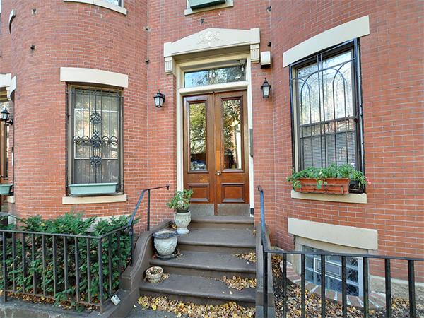 a front view of a house with a porch