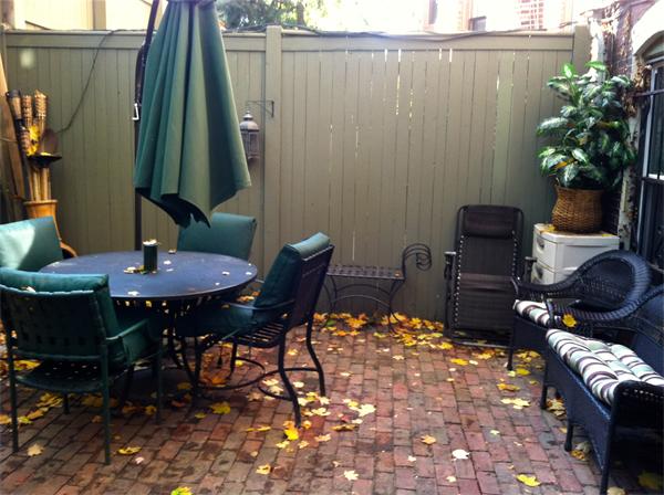 124 Chandler Street, Unit A Boston, MA 02116 - Photo 14 of 14 a backyard of a house with table and chairs