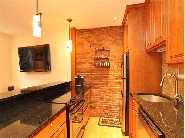 124 Chandler Street, Unit A Boston, MA 02116 - Photo 3 of 14 a bathroom with a sink and a mirror