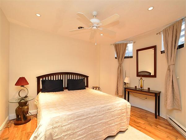 124 Chandler Street, Unit A Boston, MA 02116 - Photo 8 of 14 a bedroom with a bed and a chandelier