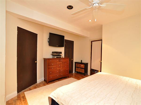 124 Chandler Street, Unit A Boston, MA 02116 - Photo 9 of 14 a bedroom with a bed and a television