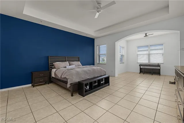 a bedroom with a bed and a view of closet