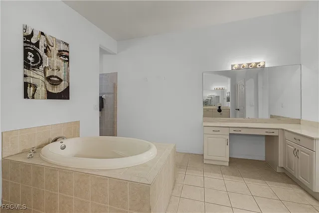 a spacious bathroom with a sink a toilet and a mirror