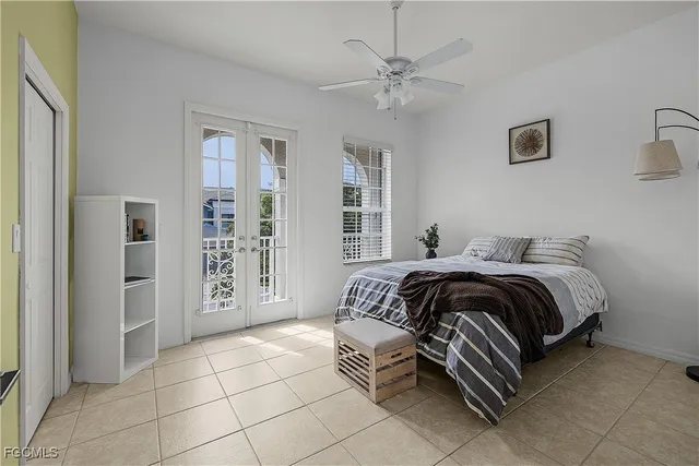 a bedroom with bed and window