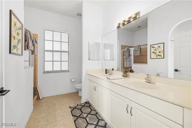 a view of a closet area with wooden floor