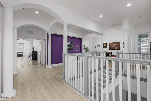 a view of a hallway with stairs
