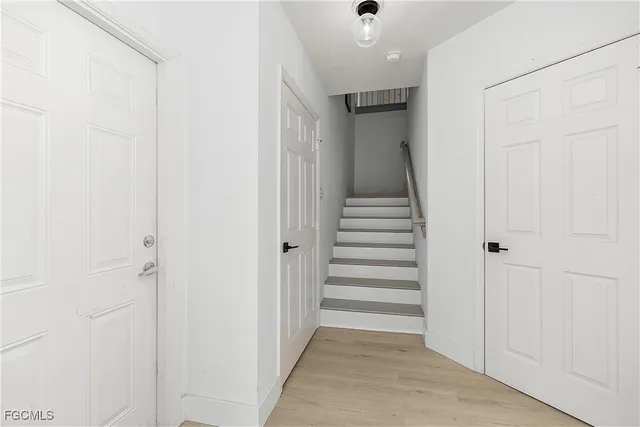 a view of storage and utility room with washer and dryer