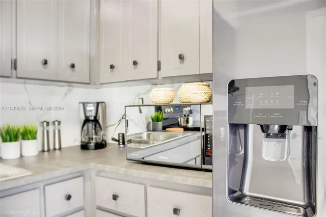 a kitchen with counter top space and cabinets