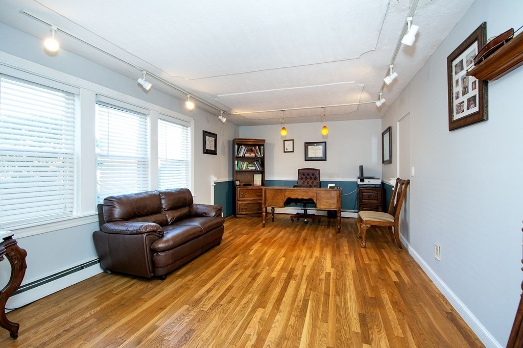 213 Beaver Dam Road Scituate, MA 02066 - Photo 21 of 28 a living room with furniture and a wooden floor