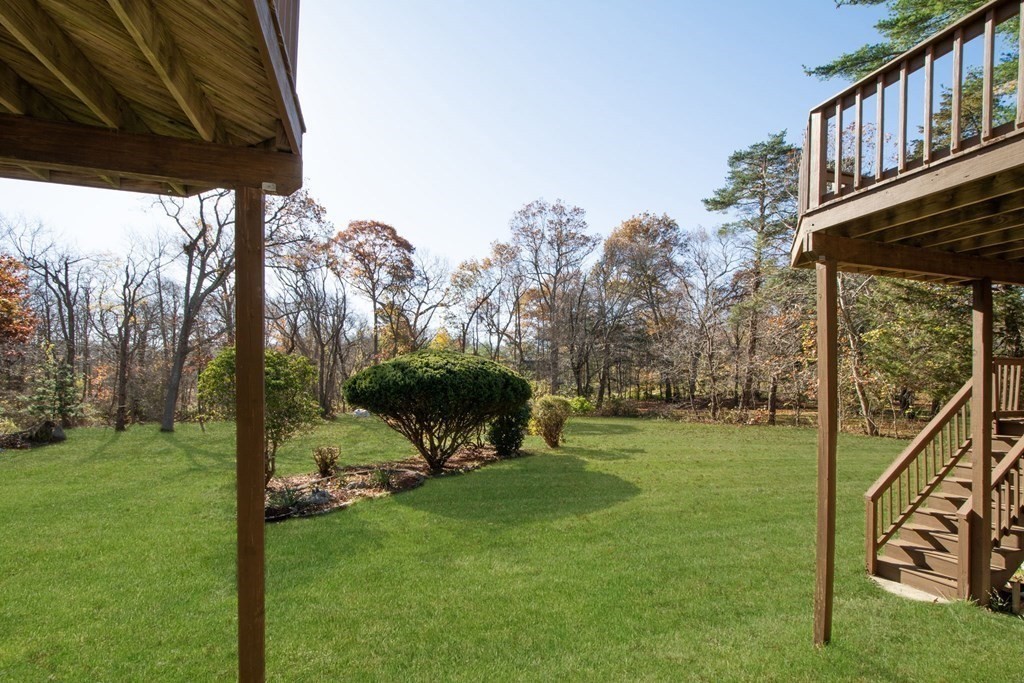 213 Beaver Dam Road Scituate, MA 02066 - Photo 26 of 28 a view of a chair and tables in the garden