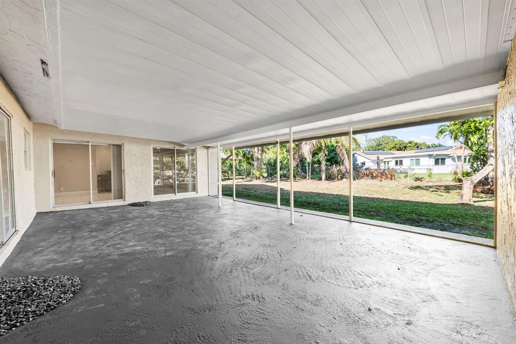 9203 Northwest 71st Street Tamarac, FL 33321 - Photo 20 of 23 a view of empty room with floor to ceiling window