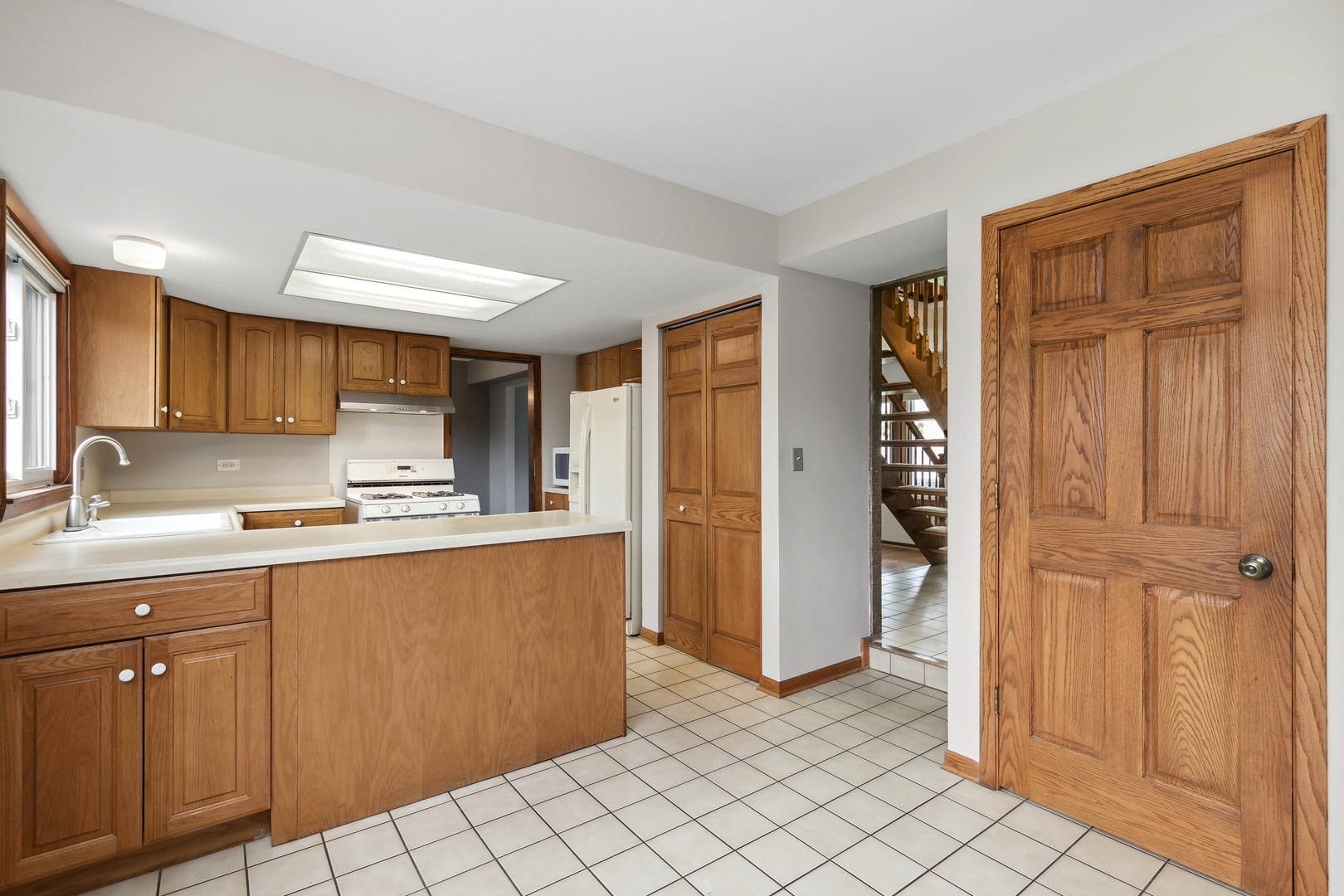 27 Joslyn Drive Elgin, IL 60120 - Photo 5 of 17 a kitchen with stainless steel appliances granite countertop a refrigerator and a sink