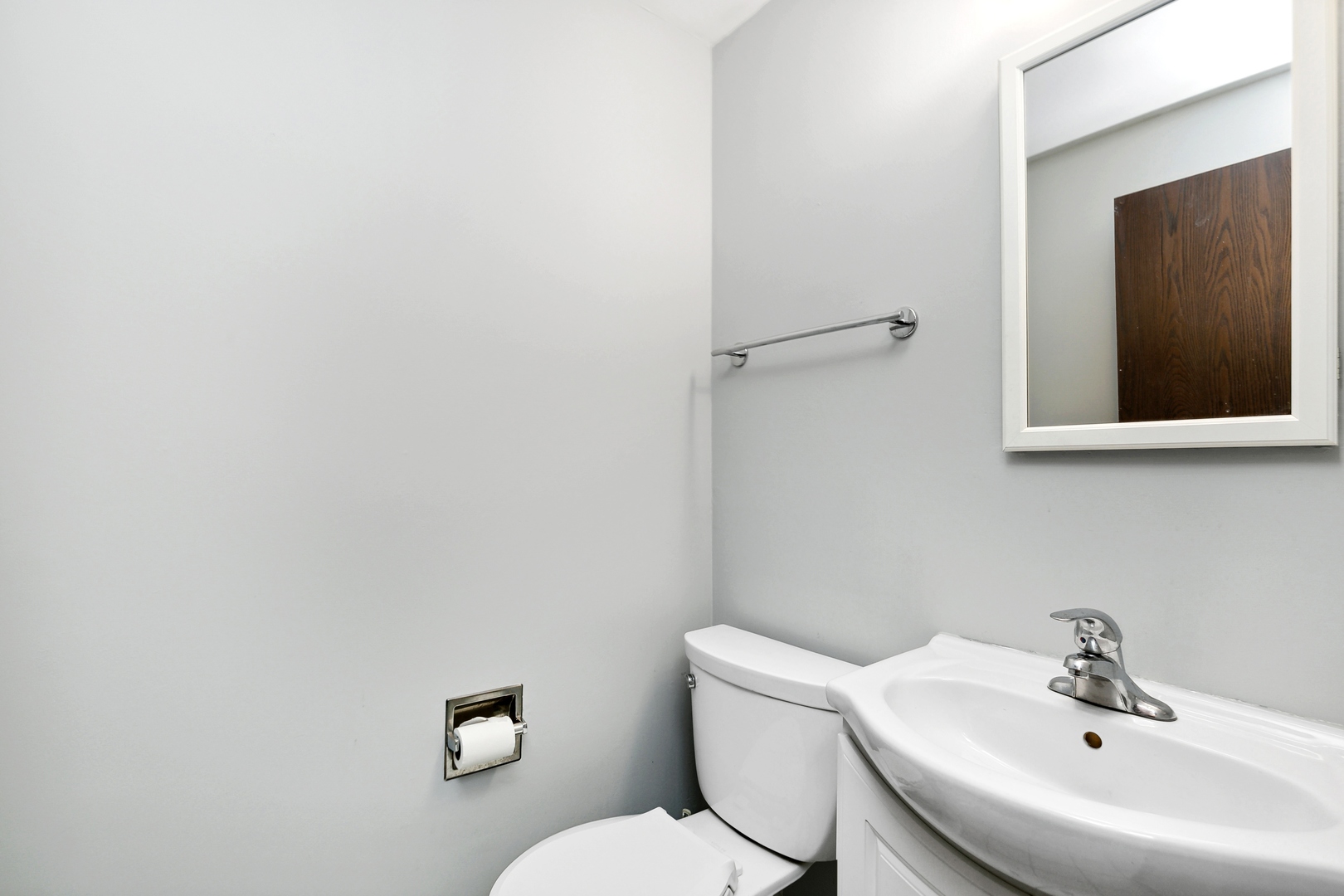 27 Joslyn Drive Elgin, IL 60120 - Photo 7 of 17 a bathroom with a sink mirror and toilet