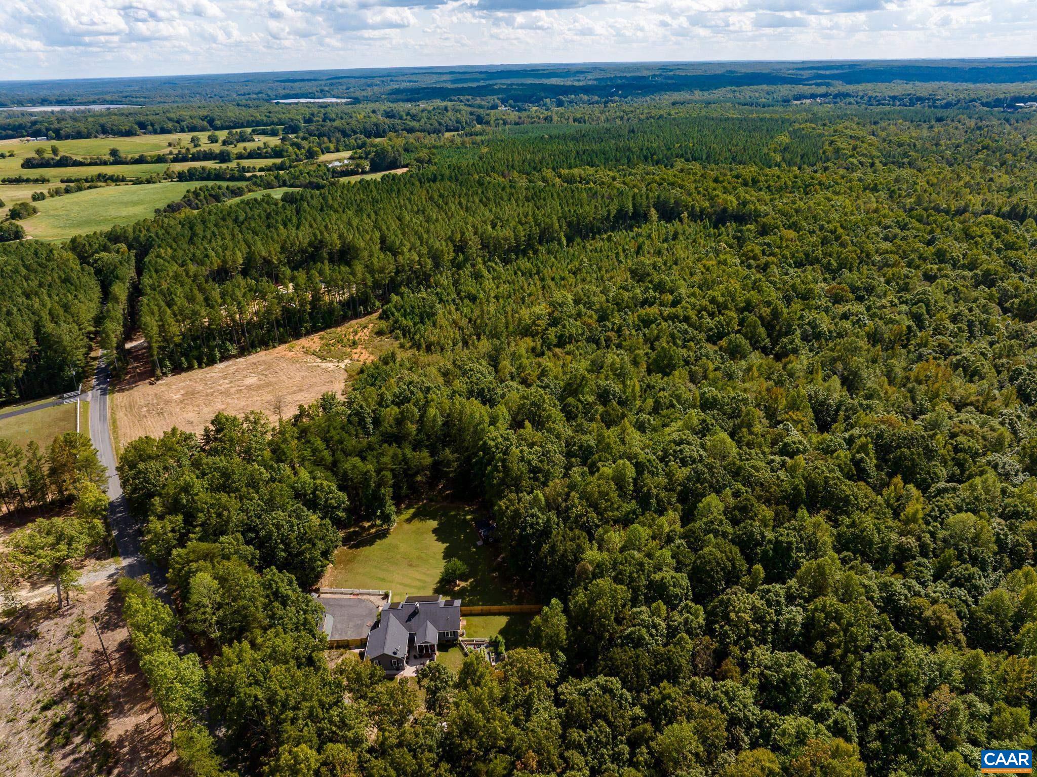 0 Tisdale Road Louisa, VA 23093 - Photo 7 of 14 a view of a lake with a building in the background
