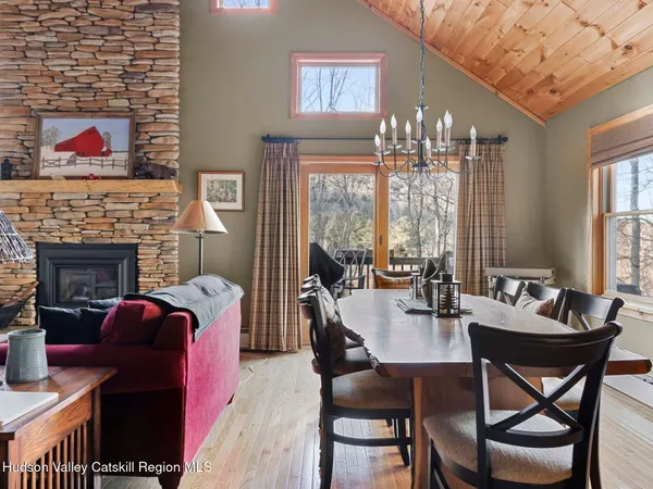 a view of a dining room with furniture window and outside view