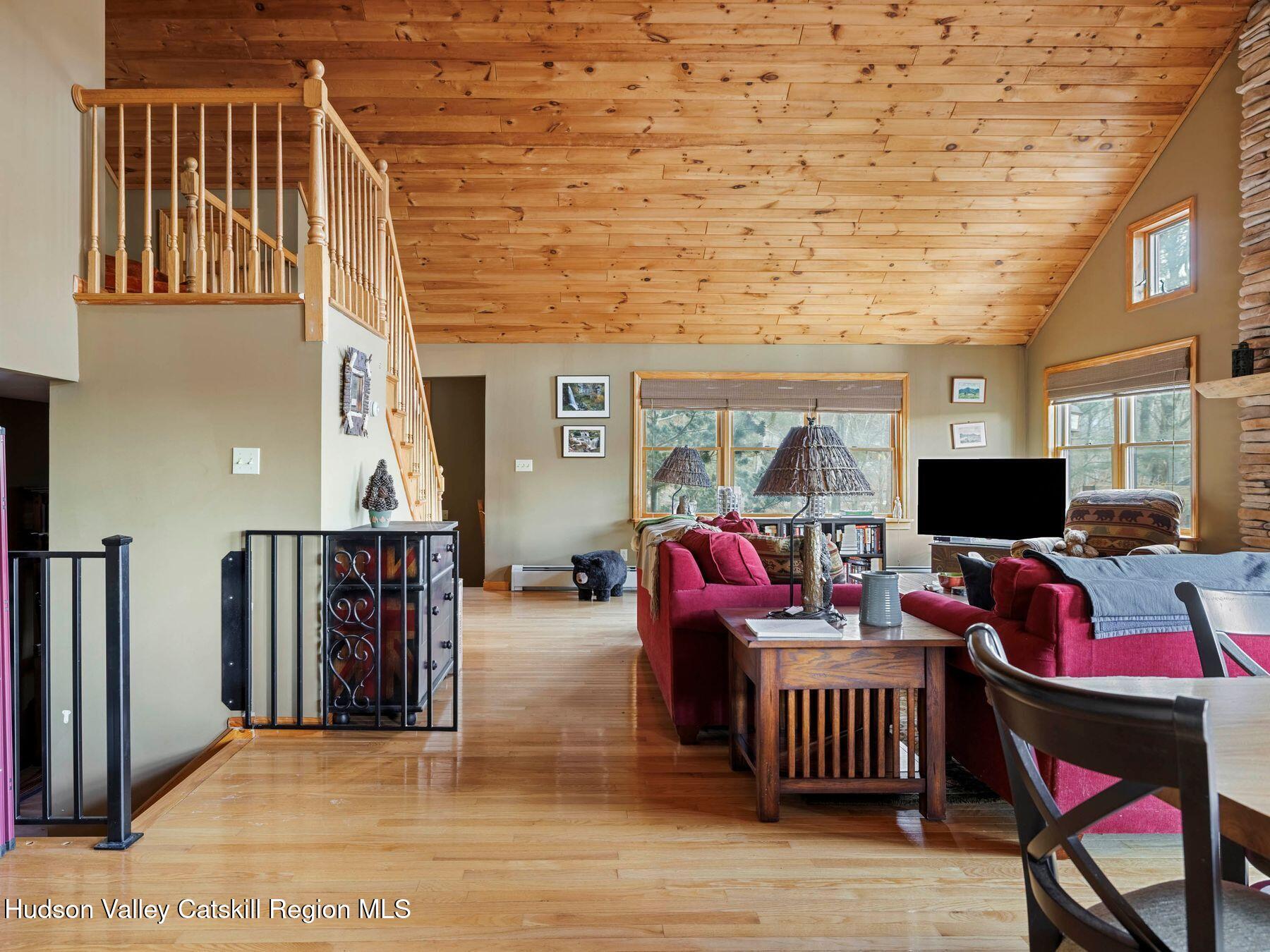 83 Lawrence Road Jewett, NY 12442 - Photo 13 of 52 a living room with furniture and a flat screen tv