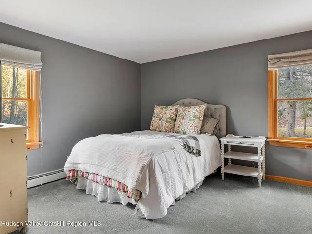 a view of room with furniture and a flat tv screen