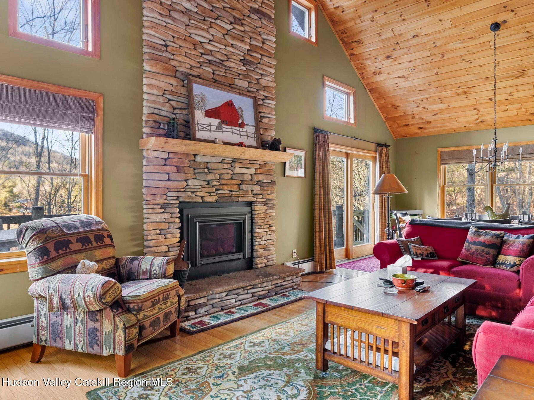 83 Lawrence Road Jewett, NY 12442 - Photo 2 of 52 a living room with furniture and a fireplace