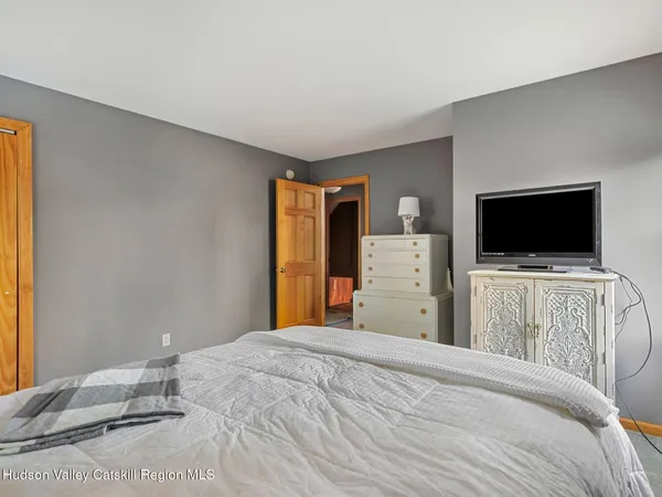 a bed room with two bed and a window