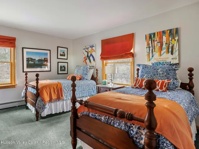 a bedroom with a bed and a television