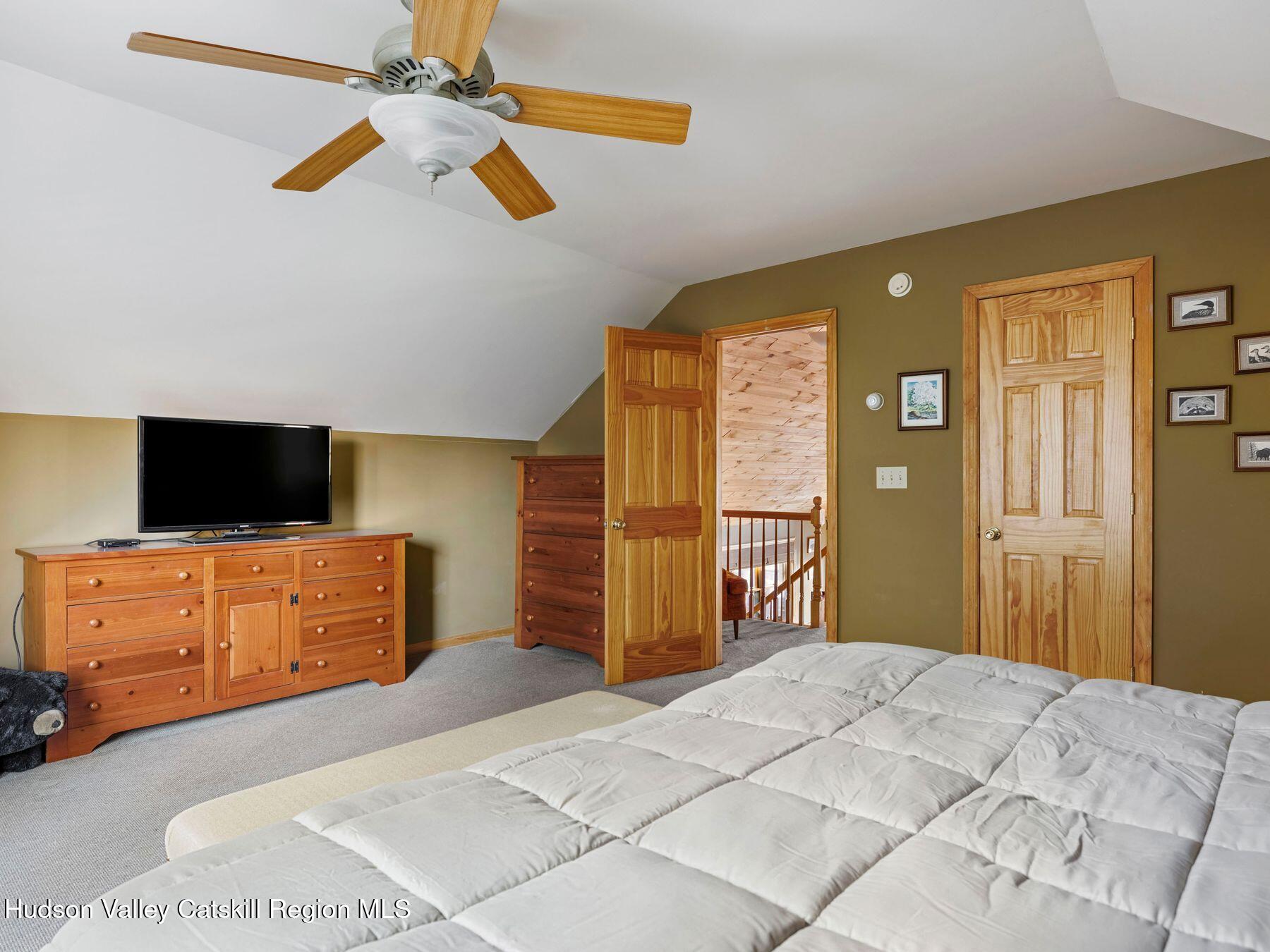83 Lawrence Road Jewett, NY 12442 - Photo 27 of 52 a bedroom with a bed and a dresser