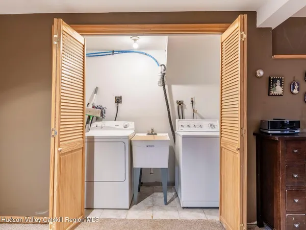 a living room with furniture and a book shelf