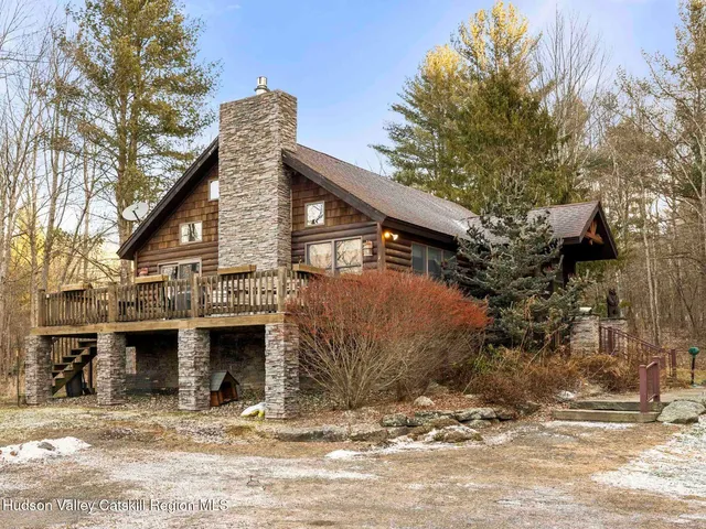 a view of a dry yard with trees