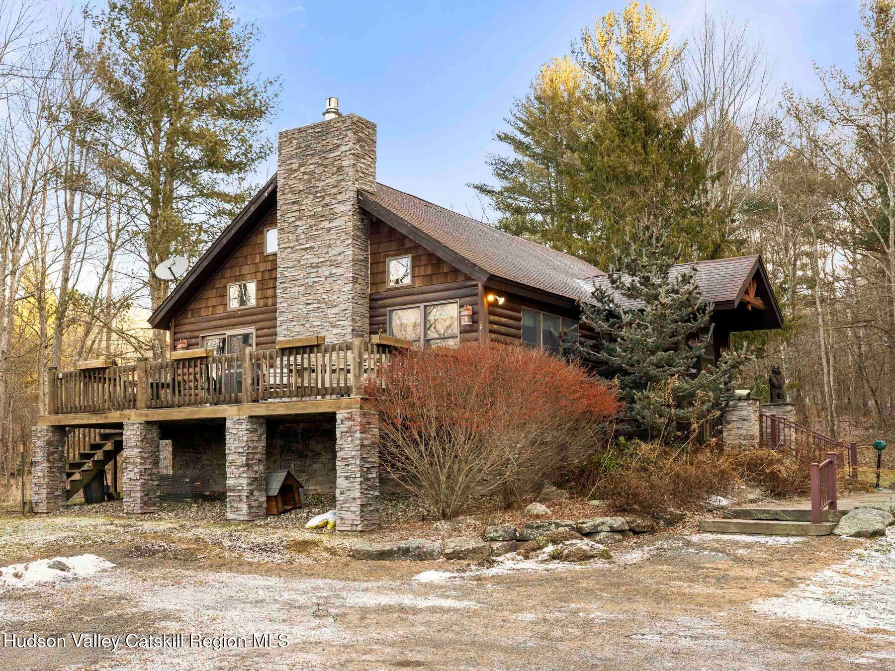83 Lawrence Road Jewett, NY 12442 - Photo 38 of 52 a view of a house with a yard