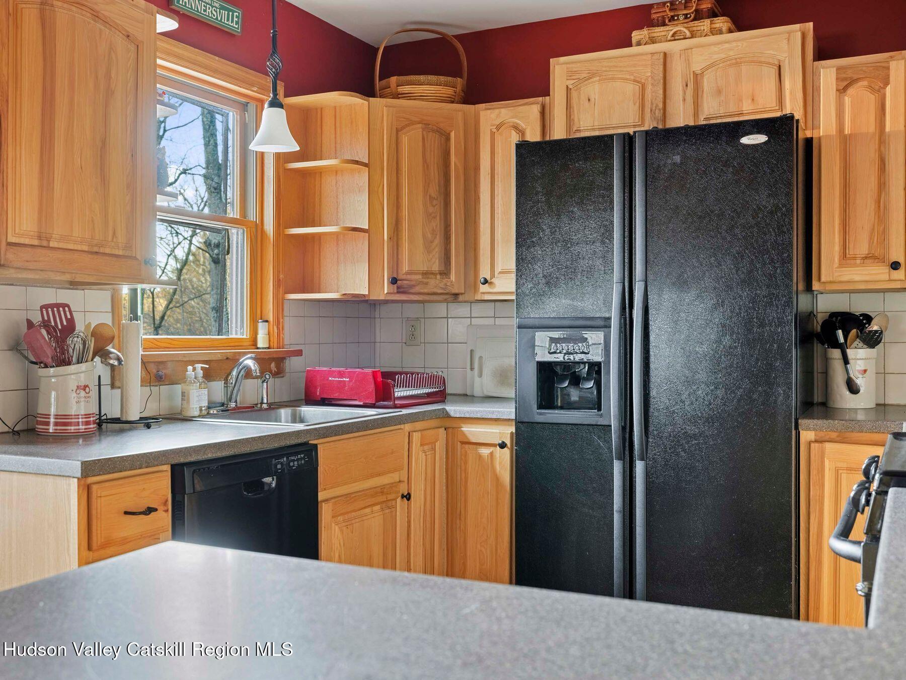 83 Lawrence Road Jewett, NY 12442 - Photo 9 of 52 a kitchen with stainless steel appliances granite countertop a refrigerator and a sink