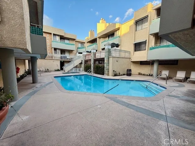 a view of a building with a swimming pool