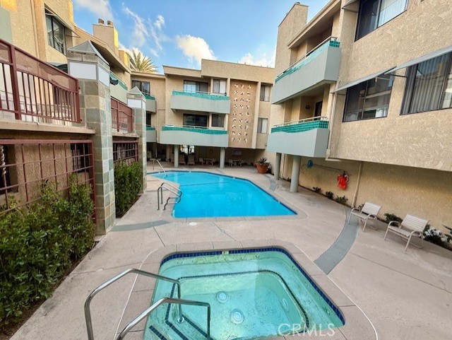 19009 Sherman Way, Unit 34 Reseda, CA 91335 - Photo 2 of 27 a view of a patio with a table and chairs
