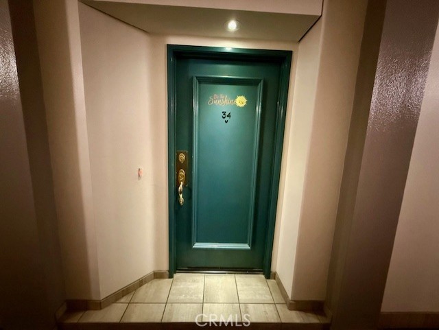 19009 Sherman Way, Unit 34 Reseda, CA 91335 - Photo 27 of 27 a view of a hallway with wooden floor and a bathroom