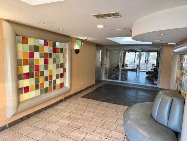 19009 Sherman Way, Unit 34 Reseda, CA 91335 - Photo 3 of 27 a view of front door with furniture and a rug