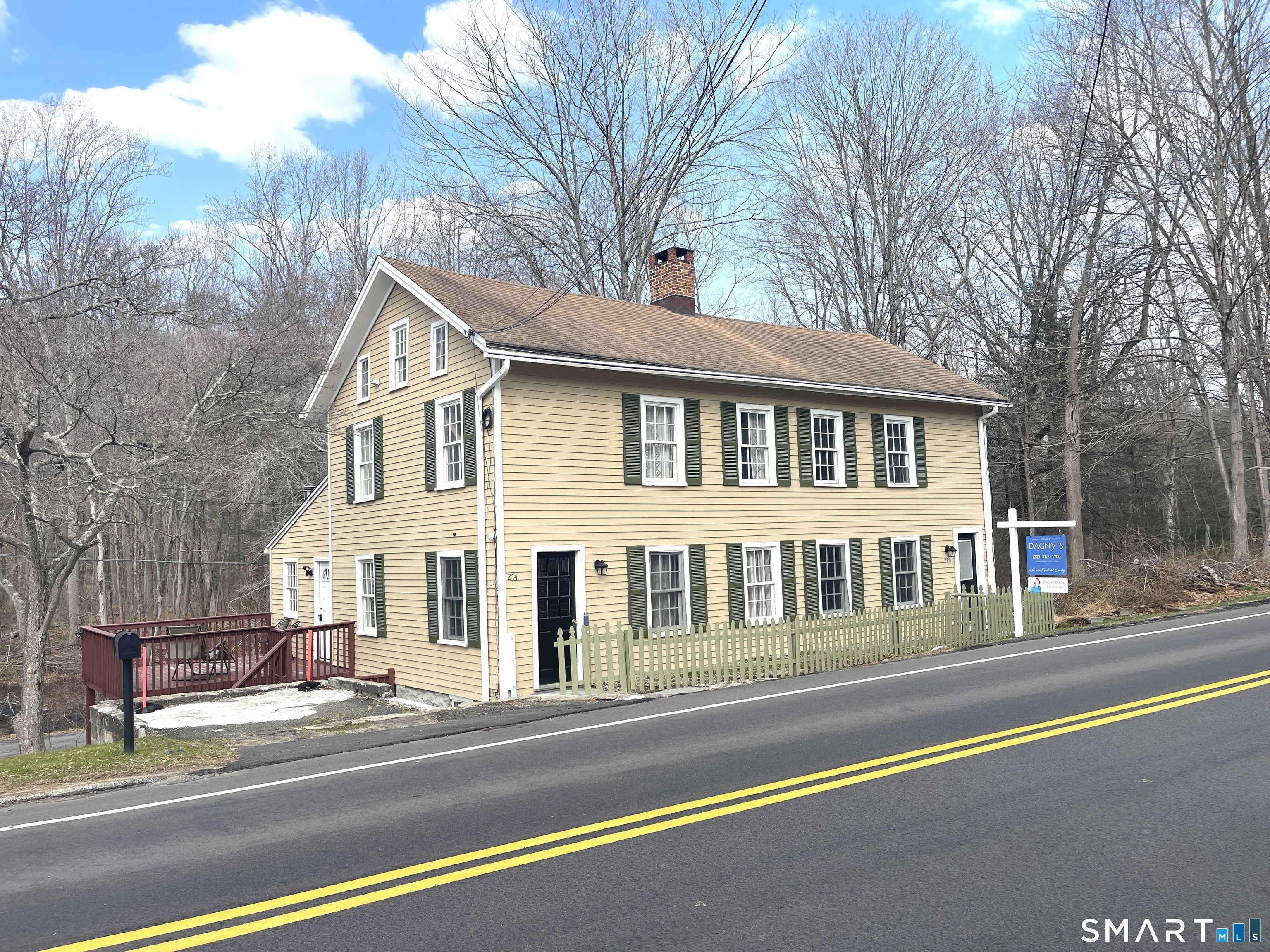a view of a white house with a large windows