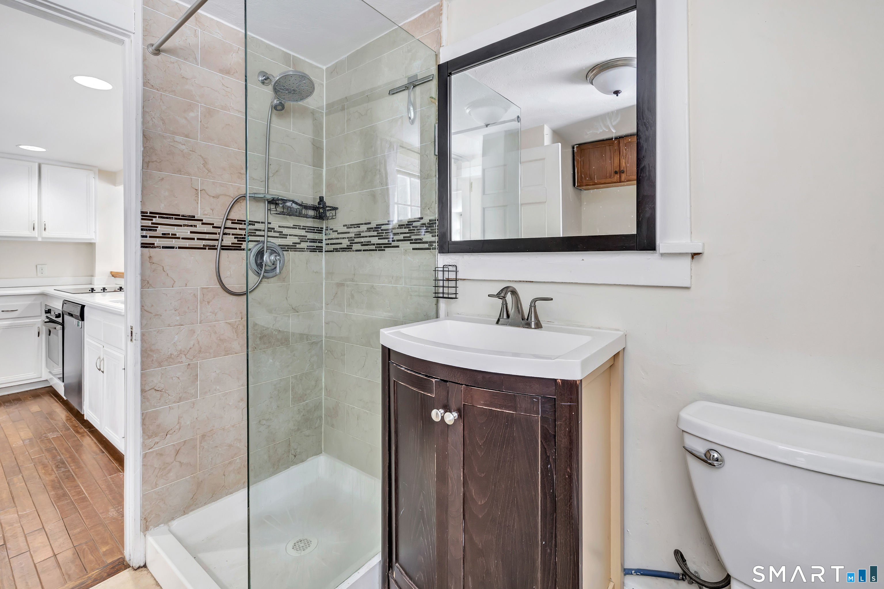 274 Lyons Plain Road Weston, CT 06883 - Photo 11 of 40 a bathroom with a sink a toilet and shower