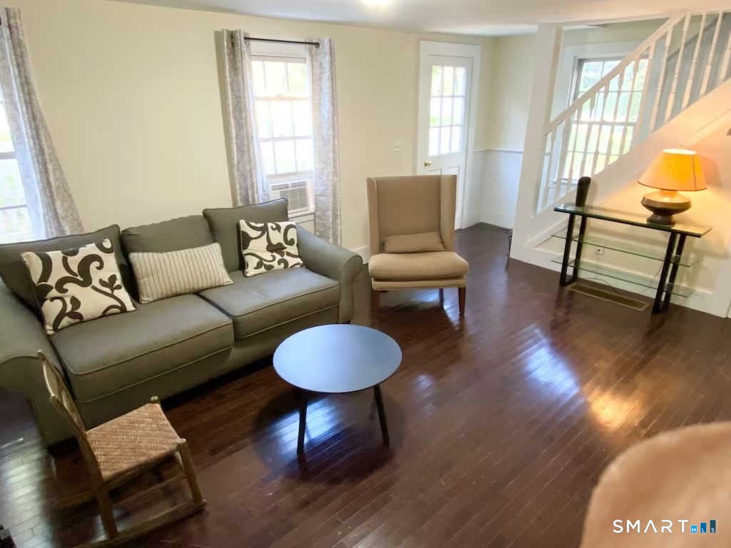 274 Lyons Plain Road Weston, CT 06883 - Photo 20 of 40 a living room with furniture and a wooden floor