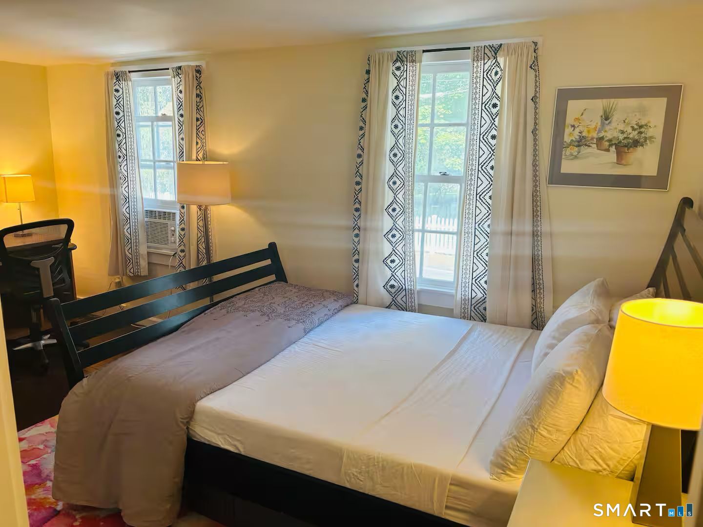 274 Lyons Plain Road Weston, CT 06883 - Photo 32 of 40 a bedroom with a bed and wooden floor