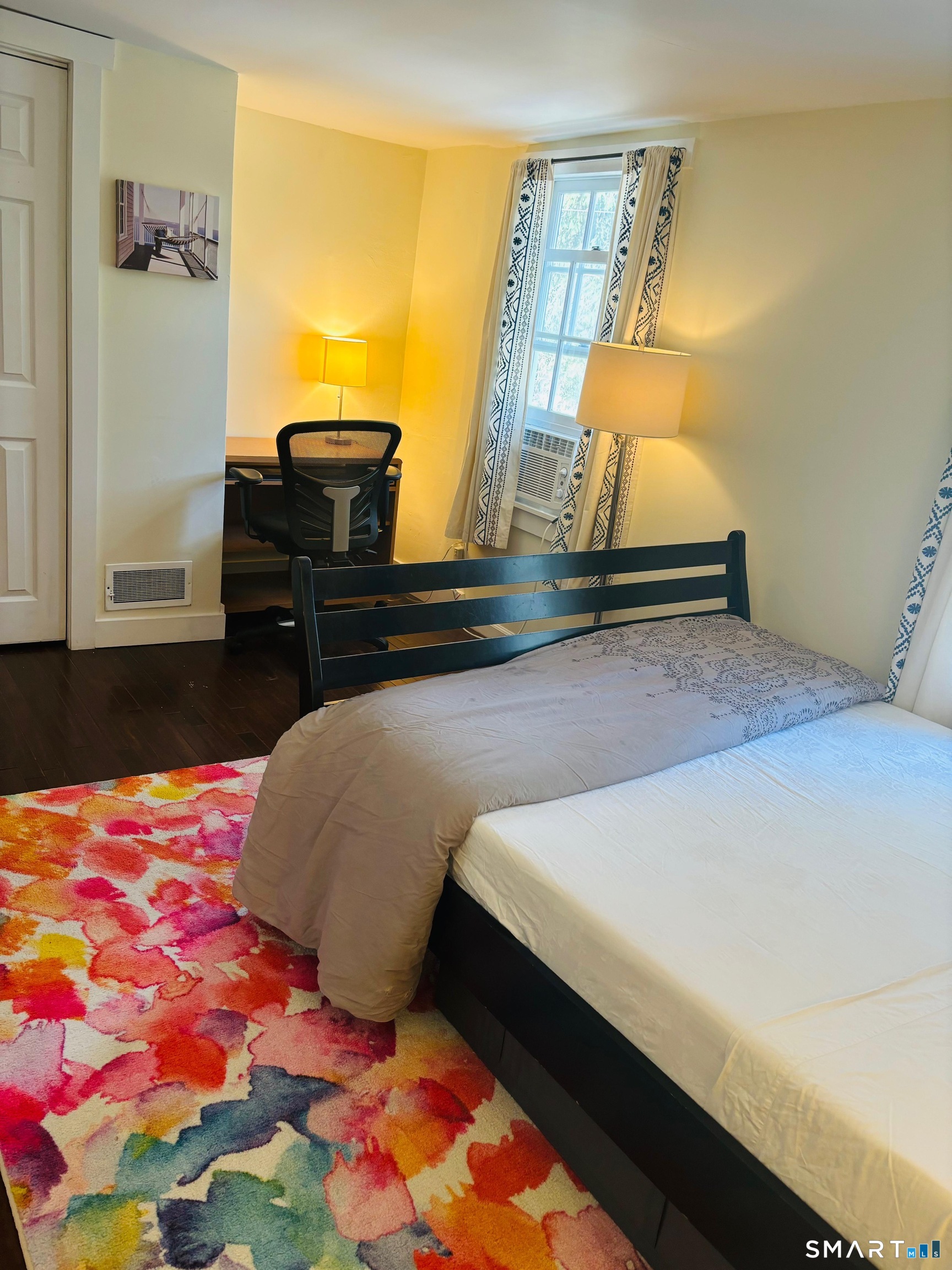 274 Lyons Plain Road Weston, CT 06883 - Photo 33 of 40 a bedroom with a bed and dresser with mirror