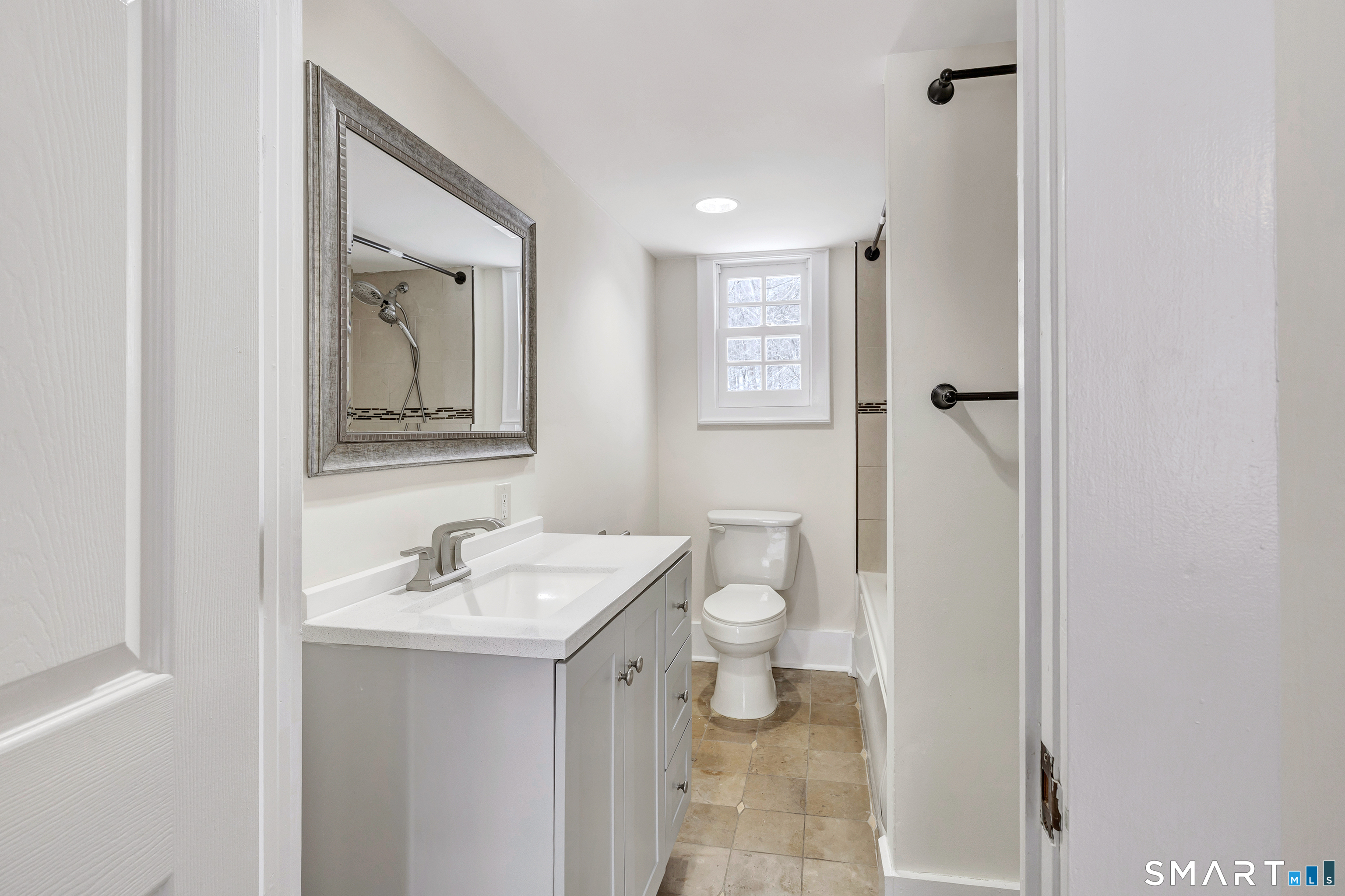 274 Lyons Plain Road Weston, CT 06883 - Photo 35 of 40 a bathroom with a sink and a mirror