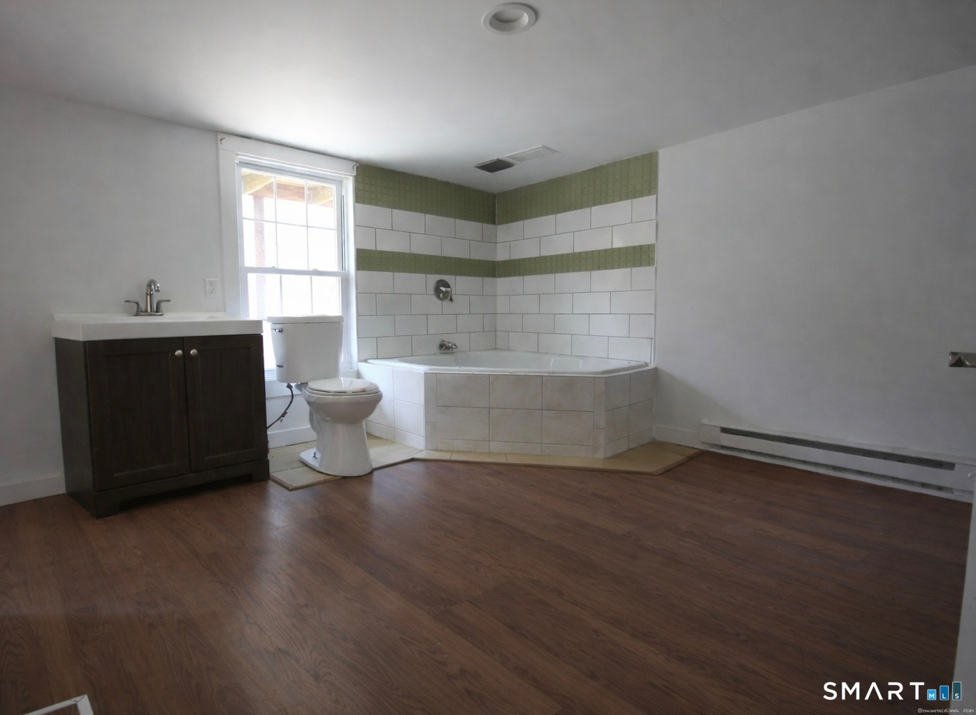 274 Lyons Plain Road Weston, CT 06883 - Photo 39 of 40 a living room with hard wood floors and a window