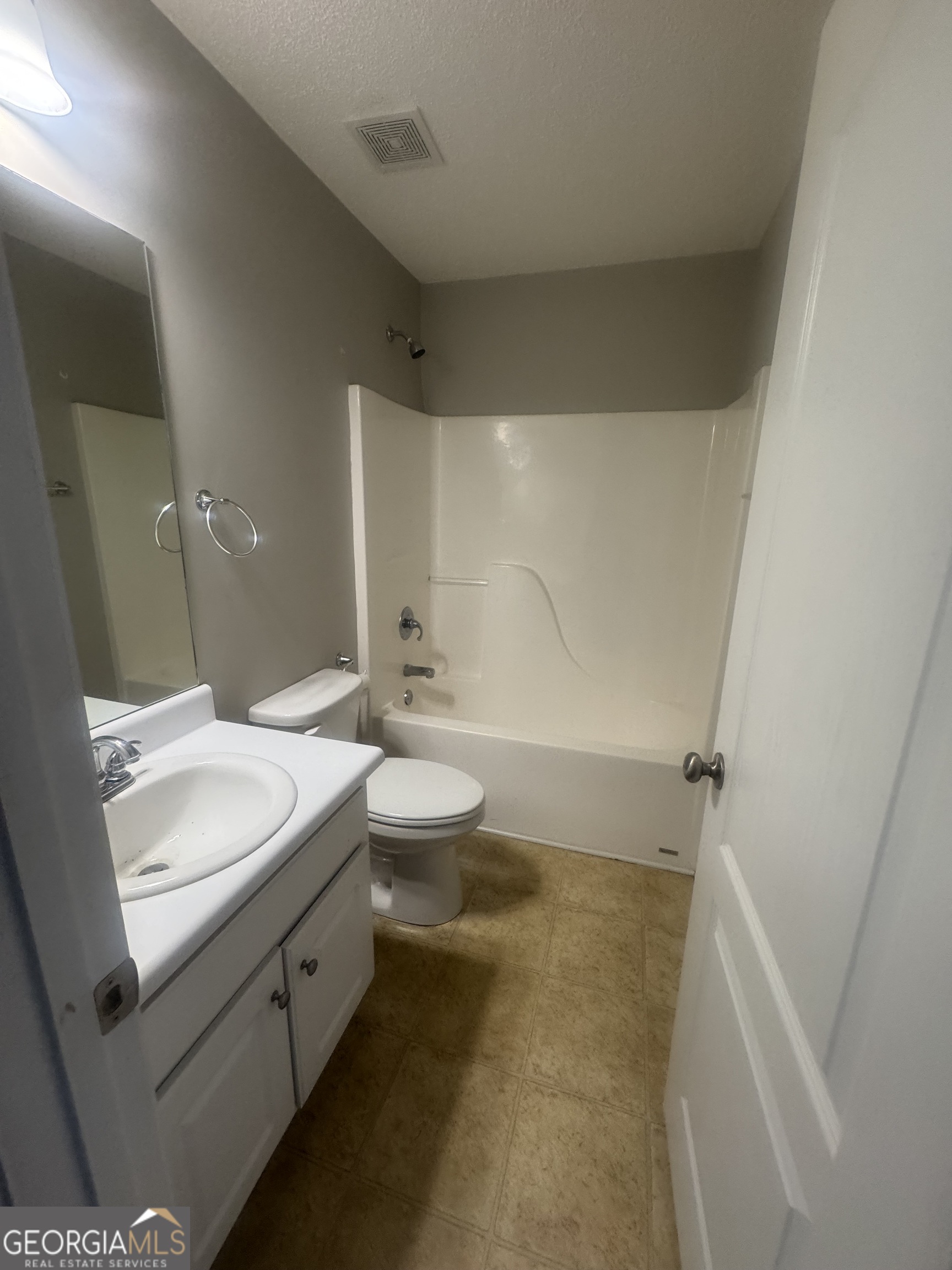 180 Laurel Oaks Lane Jefferson, GA 30549 - Photo 12 of 26 a bathroom with a double vanity sink toilet and shower