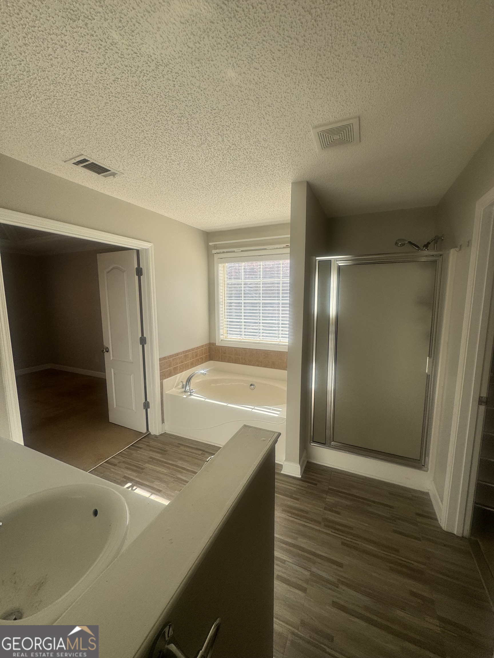 180 Laurel Oaks Lane Jefferson, GA 30549 - Photo 20 of 26 a view of an empty room and wooden floor