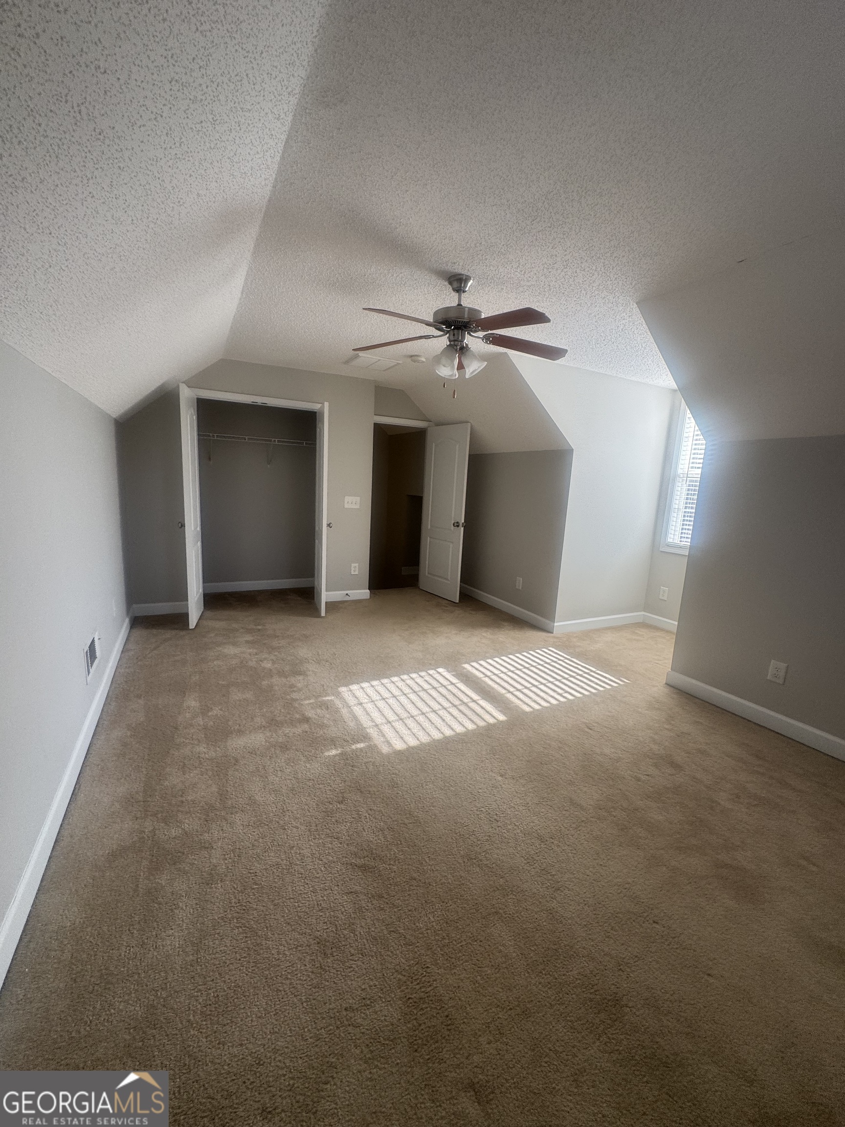 180 Laurel Oaks Lane Jefferson, GA 30549 - Photo 7 of 26 a view of a livingroom with a ceiling fan and window