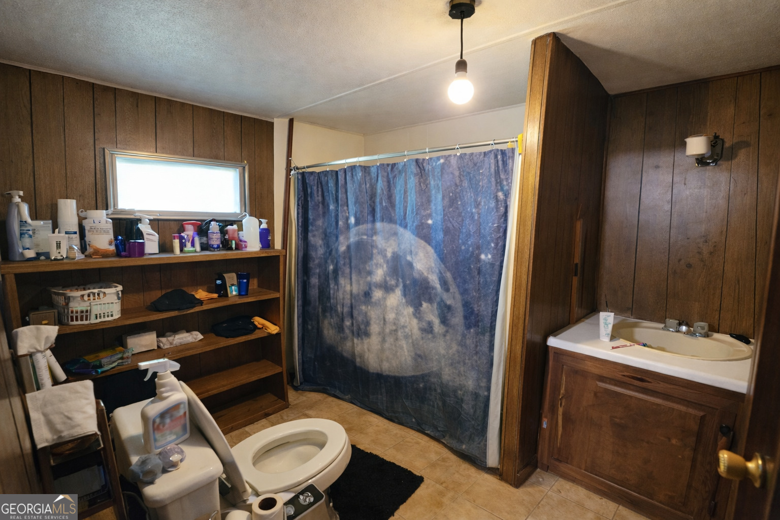 200 Homer Stephens Road Cornelia, GA 30531 - Photo 13 of 16 a bathroom with a toilet a sink and shower