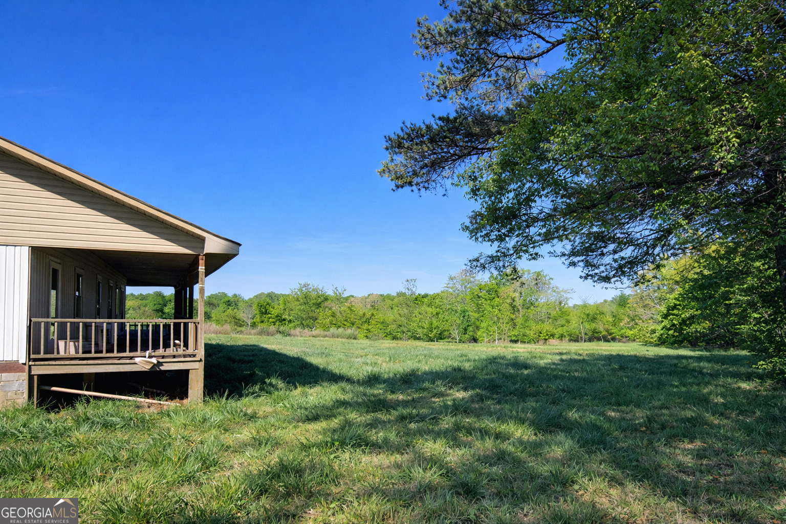 200 Homer Stephens Road Cornelia, GA 30531 - Photo 3 of 16 a view of backyard with deck and garden